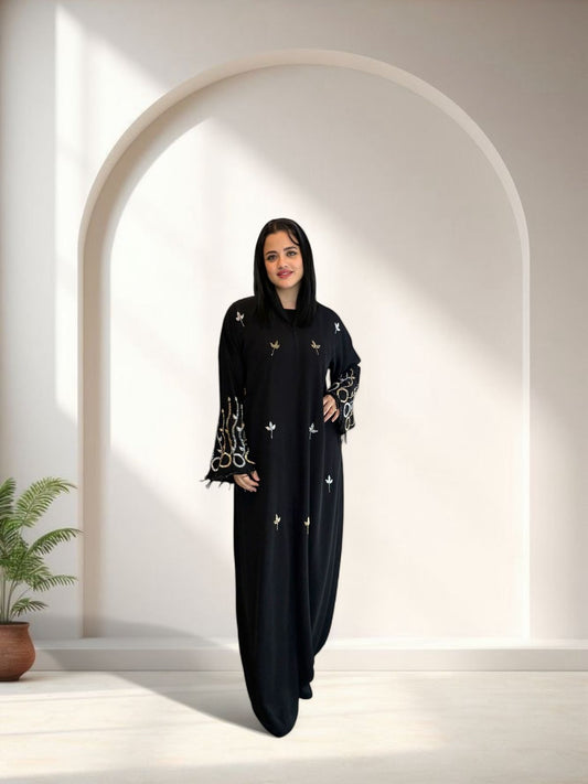Black abaya with embroidered flowers by La Perle

