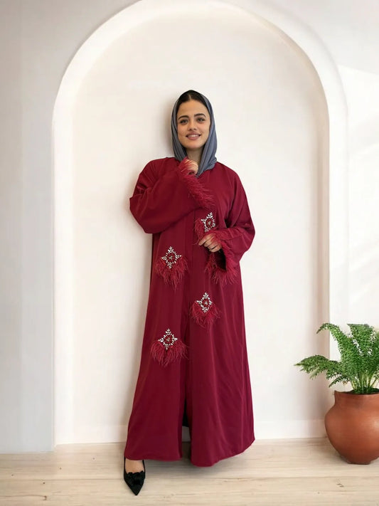 باية حمراء فاخرة مزينة بتفاصيل لامعة وريش | Red luxury abaya with feathers and embellishments