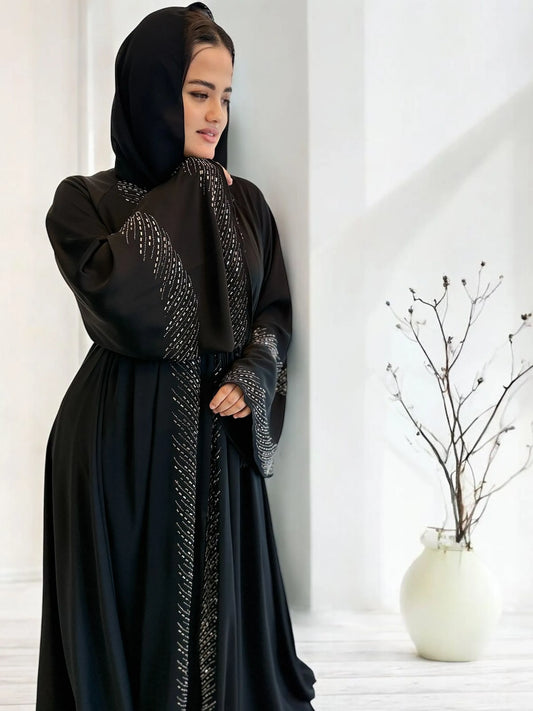 عباية ندا, عباية تطريز يدوي, عباية فخمة, عبايات سهرة, عبايات رسمية, عباءة إماراتية, front open abaya, nida fabric abaya, shiny embroidery abaya, black modest dress, elegant abayas, evening abaya, beaded abaya